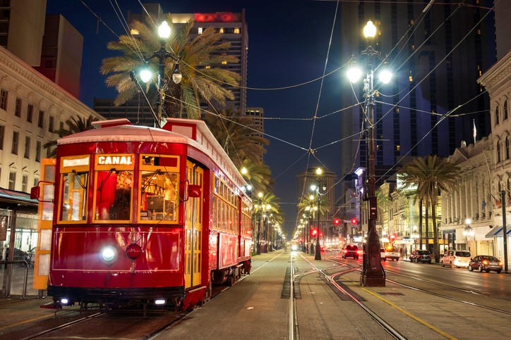 New Orleans trolley at French Quarter on Main Street at night.