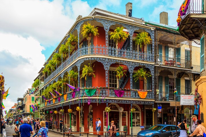 Visitors explore the colorful streets of the French Quarter in New Orleans.